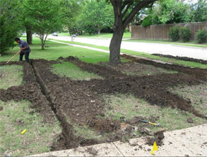 one of our Niagara Falls sprinkler installation techs is preparing the trenches